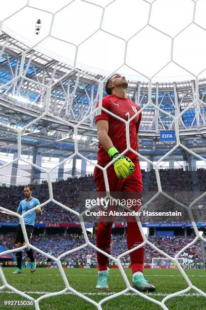 Fernando Muslera of Uruguay looks dejected after fumbling the ball and conceding from a Antoine Griezmann of France shot during the 2018 FIFA World...