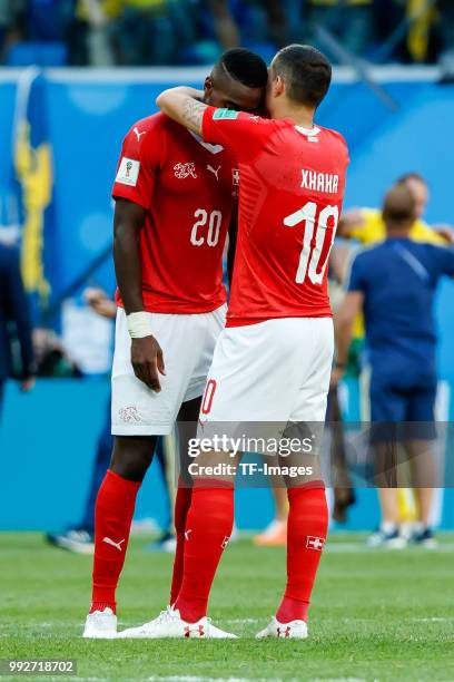 Johan Djourou of Switzerland and Granit Xhaka of Switzerland look dejected after the 2018 FIFA World Cup Russia Round of 16 match between Sweden and...