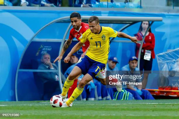 Ricardo Rodriguez of Switzerland and Viktor Claesson of Sweden battle for the ball during the 2018 FIFA World Cup Russia Round of 16 match between...