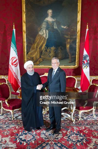 Austrian President Alexander van der Bellen and Iranian President Hassan Rouhani shake hands prior their meeting at Hofburg Palace on July 4, 2018 in...