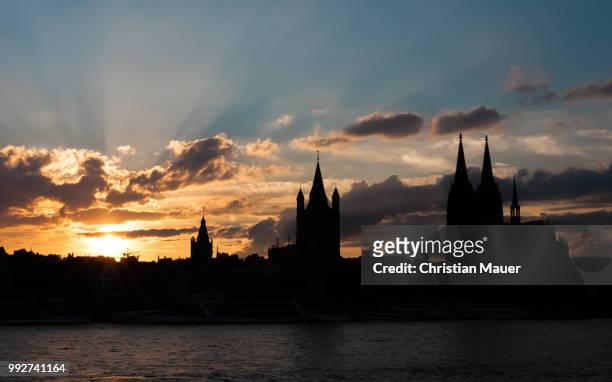 sunset in cologne - mauer stock pictures, royalty-free photos & images