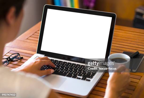 using blank white screen laptop - hands back stock pictures, royalty-free photos & images
