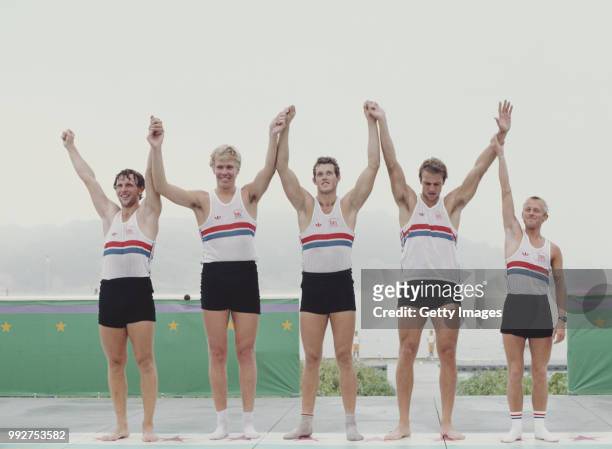 Martin Cross, Richard Budgett, Andy Holmes, and Steve Redgrave and Adrian Ellison of Great Britain celebrate winning gold at the Men's Coxed Fours...