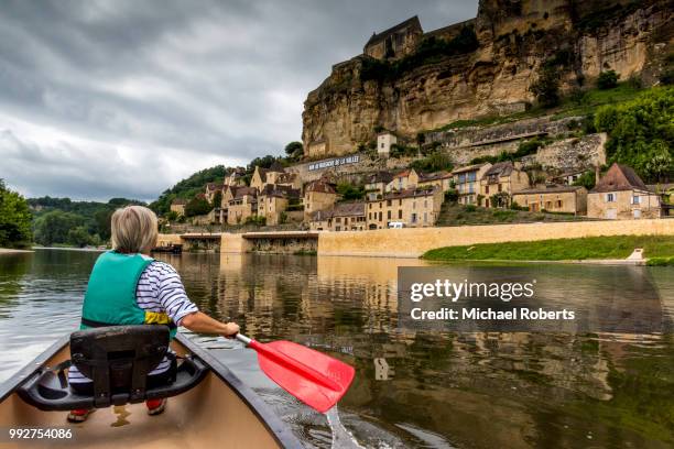 mature woman canoeing on the river dordogne at beynac-et-cazenac - dordogne river stock pictures, royalty-free photos & images