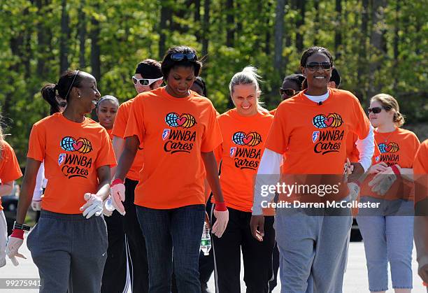 Allison Hightower, Kerri Gardin, Anete Jekabsone, and Asjha Jones of the Connecticut Sun help out in a beautify the park day at Waterford Beach Park...