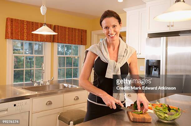 woman preparing salad - raw food diet stock pictures, royalty-free photos & images