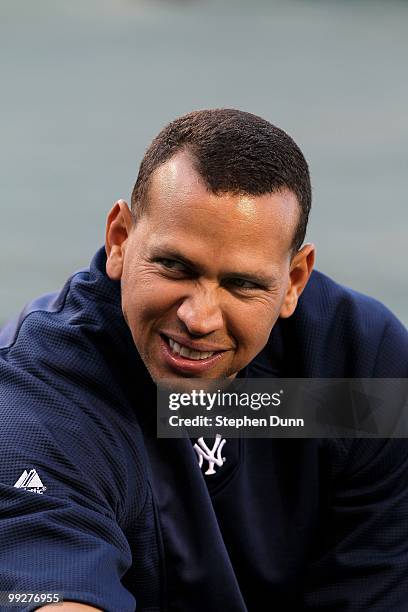 Alex Rodriguez of the New York Yankees talks with teammates as he warms up for the game with the Los Angeles Angels of Anaheim on April 23, 2010 at...