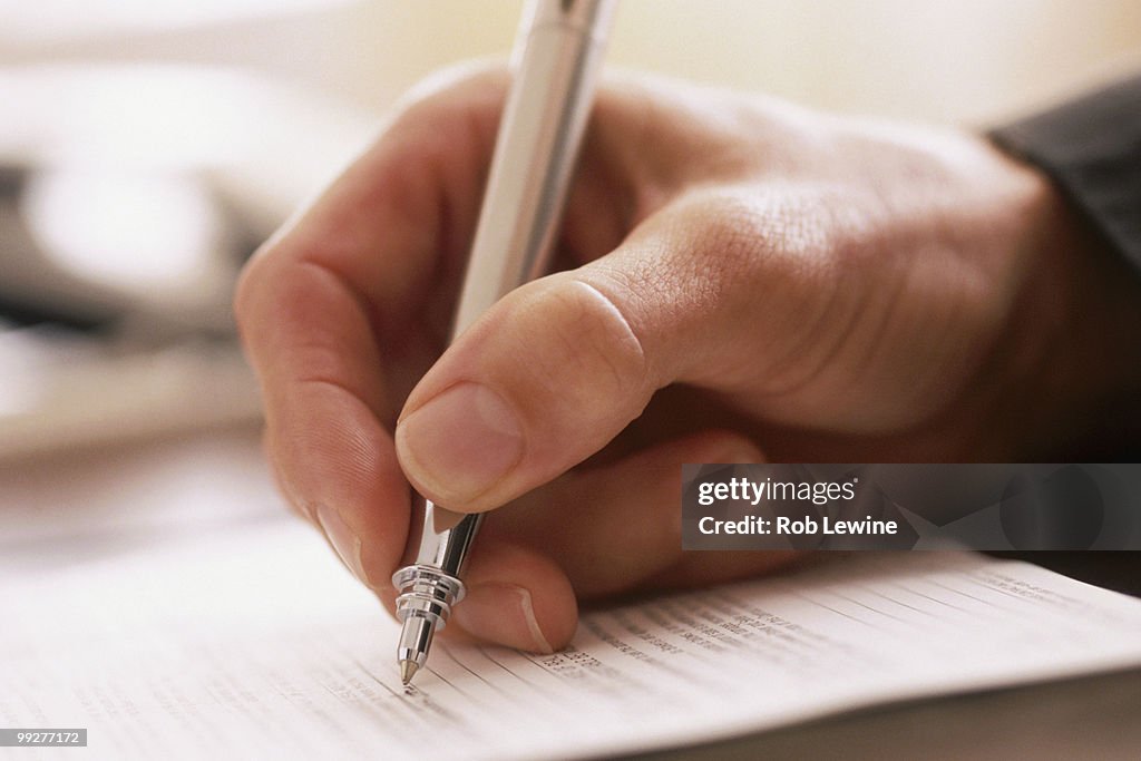 Man writing with a pen