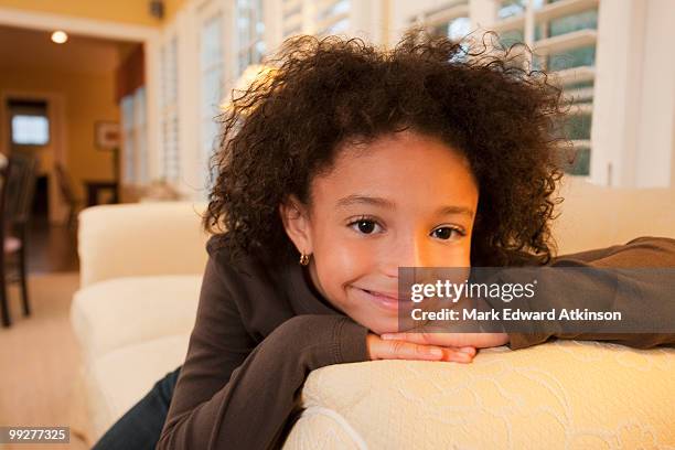 young girl on couch - mark atkinson stock pictures, royalty-free photos & images