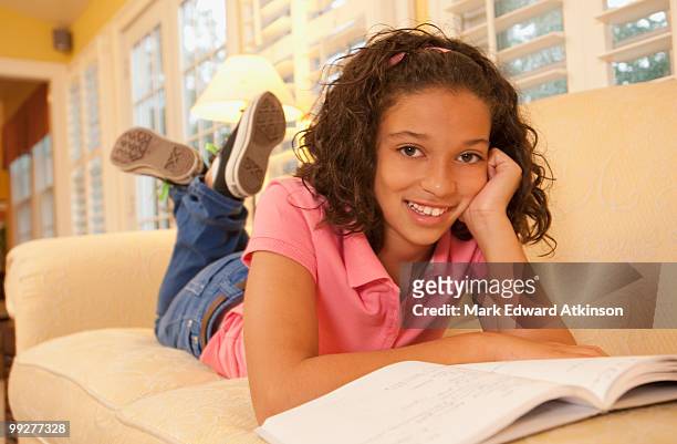 young girl on couch - mark atkinson stock pictures, royalty-free photos & images