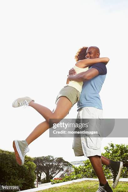 couple embracing - hedge fonds stock pictures, royalty-free photos & images