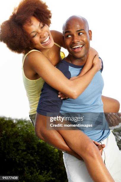 Man Giving Young Woman Piggyback Ride Smiling Side View High-Res Stock  Photo - Getty Images