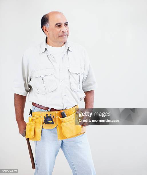 man wearing tool belt - werkzeug freisteller stock-fotos und bilder