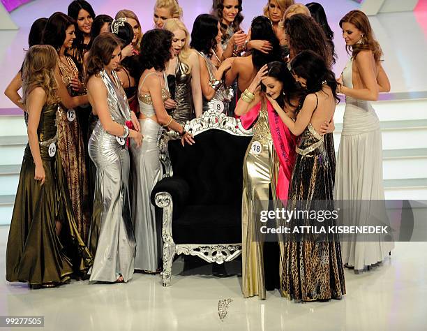 Newly-elected Miss World Hungary 2010, 22-year-old university student Agnes Dobo holds her head as her victory crown falls down after her victory for...