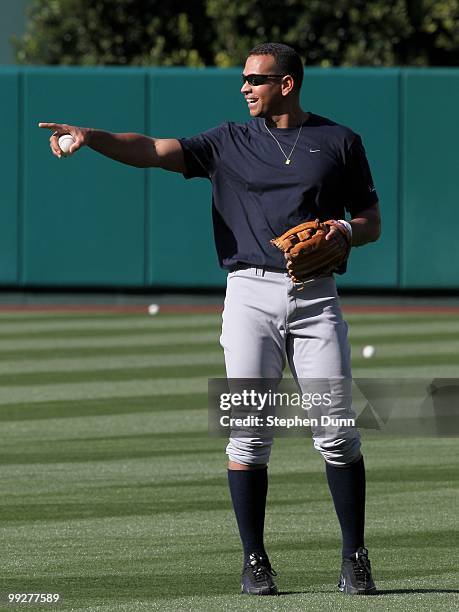 Alex Rodriguez of the New York Yankees jokes with Los Angeles Angels of Anaheim players before their game on April 23, 2010 at Angel Stadium in...