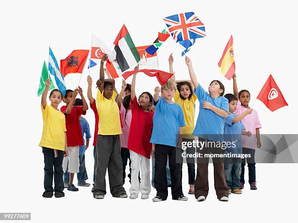 children waving flags - spain v tunisia international friendly stock-fotos und bilder