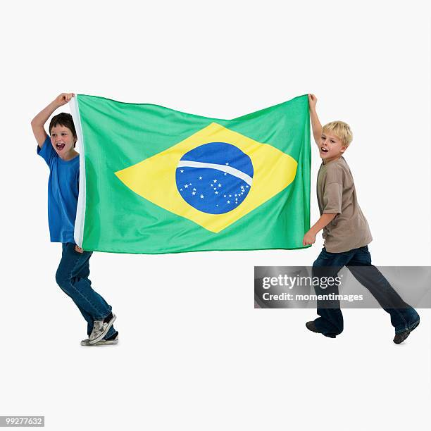 two boys carrying flag - south africa v brazil international friendly stock pictures, royalty-free photos & images
