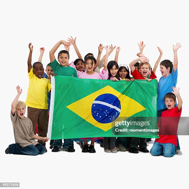 children holding flag - south africa v brazil international friendly stock pictures, royalty-free photos & images