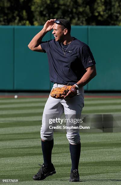 Alex Rodriguez of the New York Yankees jokes with Los Angeles Angels of Anaheim players before their game on April 23, 2010 at Angel Stadium in...