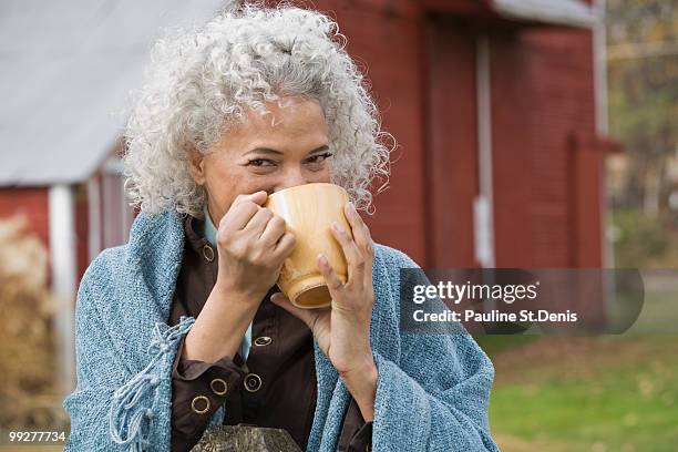 woman drinking from mug - black mug stock pictures, royalty-free photos & images