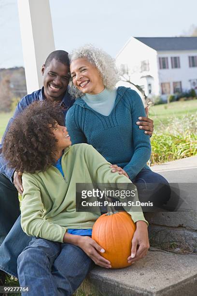 family sitting on porch - new paltz foto e immagini stock