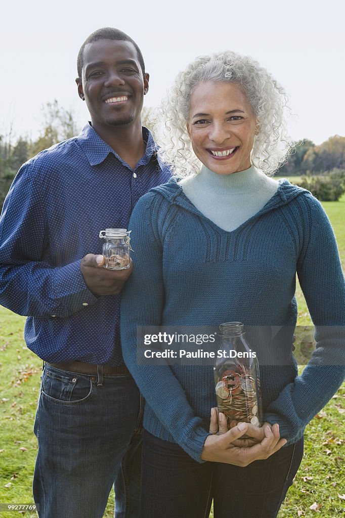 Couple holding jars