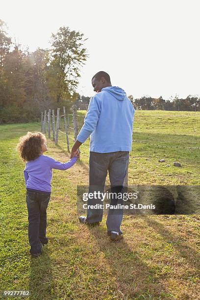 father and daughter walking - ulster county stock pictures, royalty-free photos & images