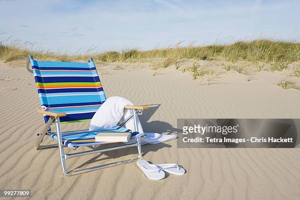 beach chair - beach towel stock pictures, royalty-free photos & images
