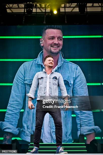 German singer Ben Zucker performs live during the show 'Die Schlagernacht des Jahres' at the Waldbuehne on June 16, 2018 in Berlin, Germany.