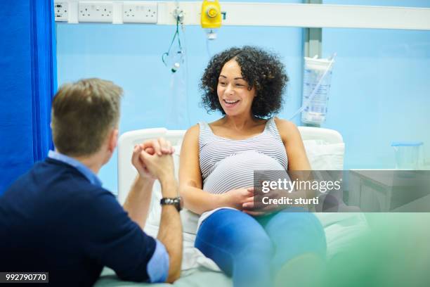 relaxed expectant parents - sturti stock pictures, royalty-free photos & images