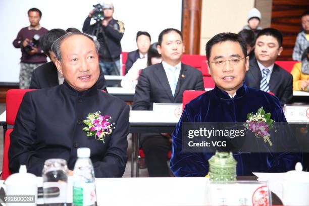 Chen Feng , chairman of HNA Group Co. Ltd., and Wang Jian , vice chairman of HNA Group Co. Ltd., attend a meeting on December 26, 2011 in Haikou,...