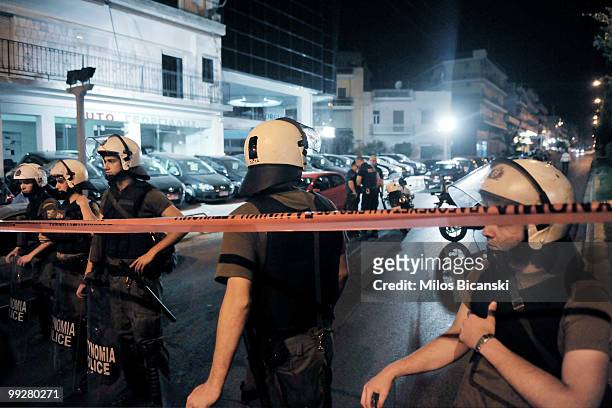 Police secure area after an explosion outside a prison wounded one perso May 13, 2010 in Korydallos, a suburb of Athens, Greece. According to...