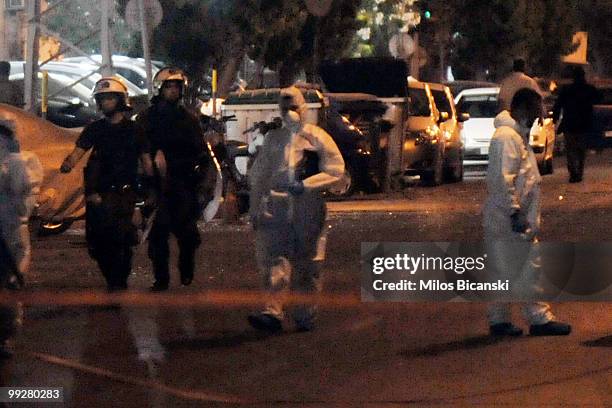 Athens , MAy 13 2010 : Policemen search after an explosion outside a prison wounded one person, in korydallos athens suburb late May 13, 2010. A...