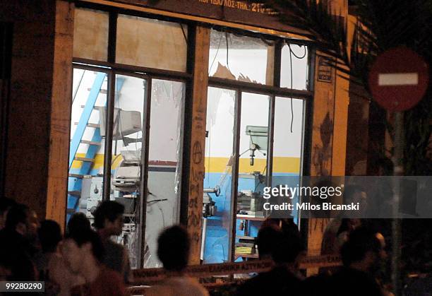 Shattered windows are seen after an explosion outside a prison wounded one perso May 13, 2010 in Korydallos, a suburb of Athens, Greece. According to...