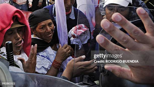 Group of indigenous people argue with policemen during a demonstration in front of the National Assembly headquarters against a proposed water...