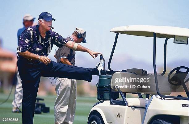 John Jacobs stretches on cart, equipment during Friday play at Prospector Course of Superstition Mountain G&CC. Senior Tour. Superstition Mountain,...