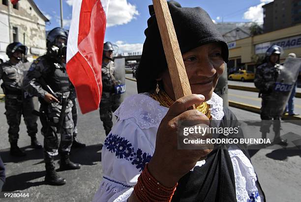 An indigenous woman takes part in a demonstration near the National Assembly headquarters against a proposed water privatization measure that could...