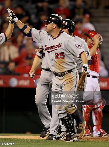 Jim Thome of the Minnesota Twins celebrates his three run home run in the eighth inning against the Los Angeles Angels of Anaheim on April 8, 2010 at...