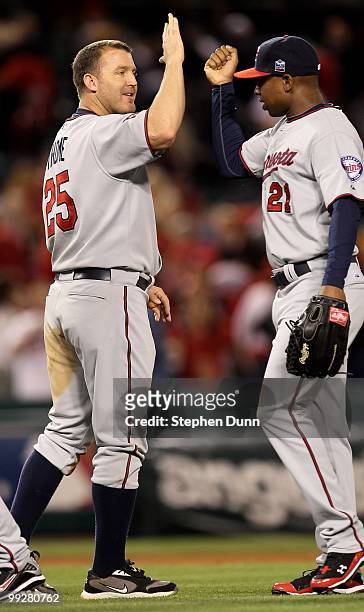 Jim Thome of the Minnesota Twins celebrates with Delmon Young after the game against the Los Angeles Angels of Anaheim on April 8, 2010 at Angel...