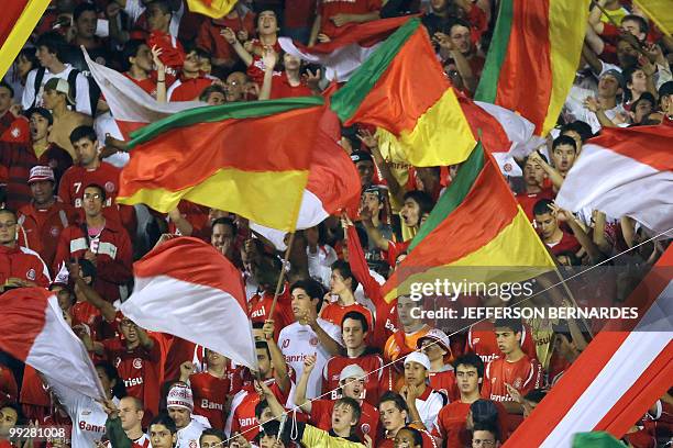 Brazilian Internacional's supporters cheer their team before the start of their Libertadores Cup football match against Argentinian Estudiantes at...