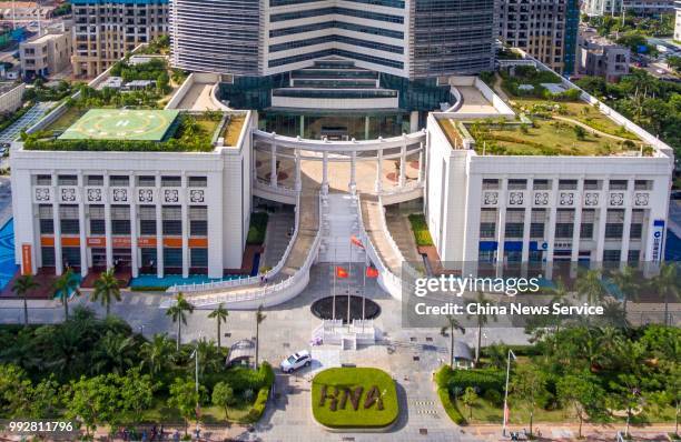 Flags of the HNA Group fly at half-mast at the headquarters on July 4, 2018 in Haikou, Hainan Province of China. Wang Jian, co-founder and chairman...
