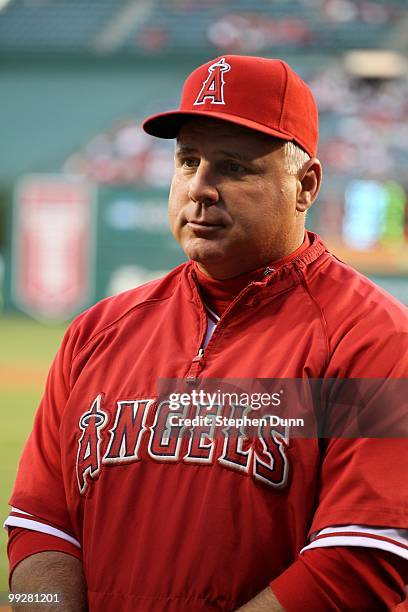 Manager Mike Scioscia of the Los Angeles Angels of Anaheim receives his 2009 American League Manager of the Year award before the game with the...