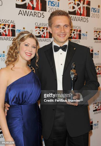 Vasily Petrenko poses with the Male Artist of the Year award with Hayley Westenra in the winners room at the Classical BRIT Awards at Royal Albert...