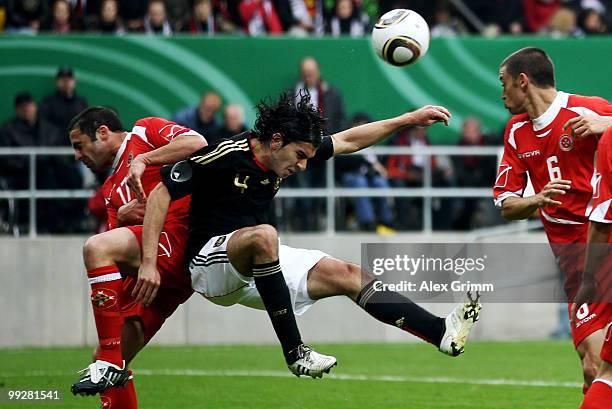 Serdar Tasci of Germany is challenged by Kenneth Scicluna and Ryan Fenech of Malta during the international friendly match between Germany and Malta...