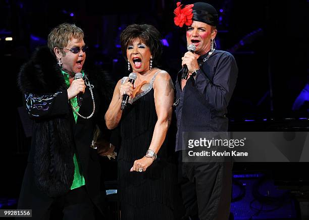 Musicians Elton John, Dame Shirley Bassey and Sting perform on stage during the Almay concert to celebrate the Rainforest Fund's 21st birthday at...