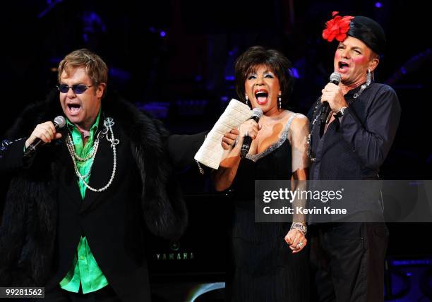 Musicians Elton John, Dame Shirley Bassey and Sting perform on stage during the Almay concert to celebrate the Rainforest Fund's 21st birthday at...