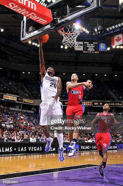 Donte Greene of the Sacramento Kings shoots a layup against Drew Gooden of the Los Angeles Clippers during the game at Arco Arena on April 8, 2010 in...