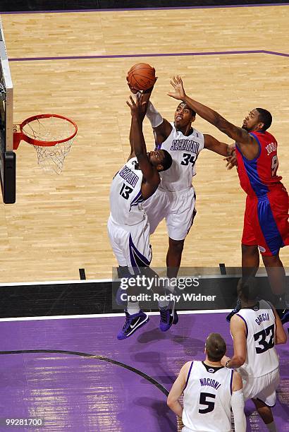 Tyreke Evans and Jason Thompson of the Sacramento Kings rebound against DeAndre Jordan of the Los Angeles Clippers during the game at Arco Arena on...