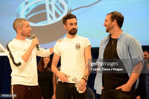 Dan Smith, Kyle Simmons and Will Farquarson of Bastille, winners of the Sky Best Group Award on stage during the Nordoff Robbins' O2 Silver Clef...