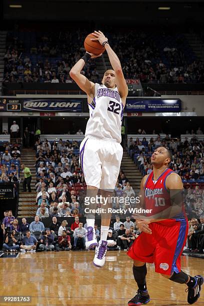 Francisco Garcia of the Sacramento Kings shoots a jump shot against Eric Gordon of the Los Angeles Clippers during the game at Arco Arena on April 8,...